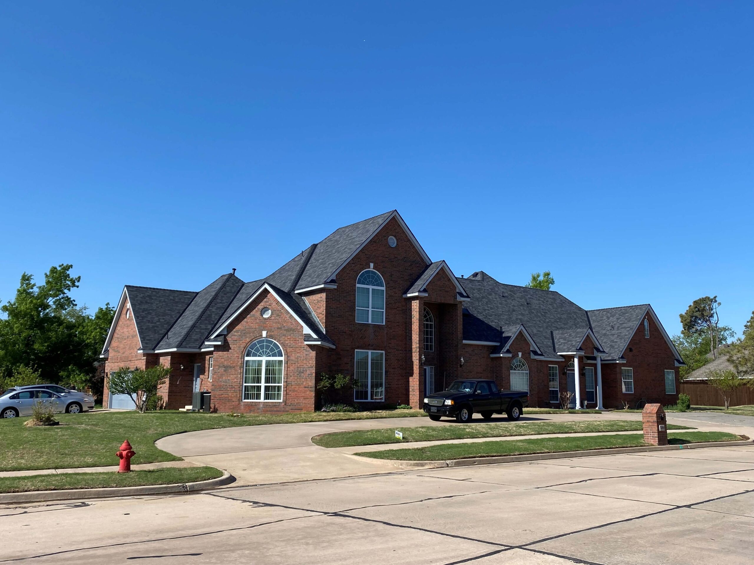 New roof on bricked residential home installed by Flex Roofing